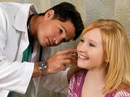 Doctor Performing Ear Inspection