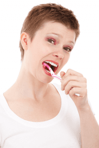 Woman Taking Care of Oral Health