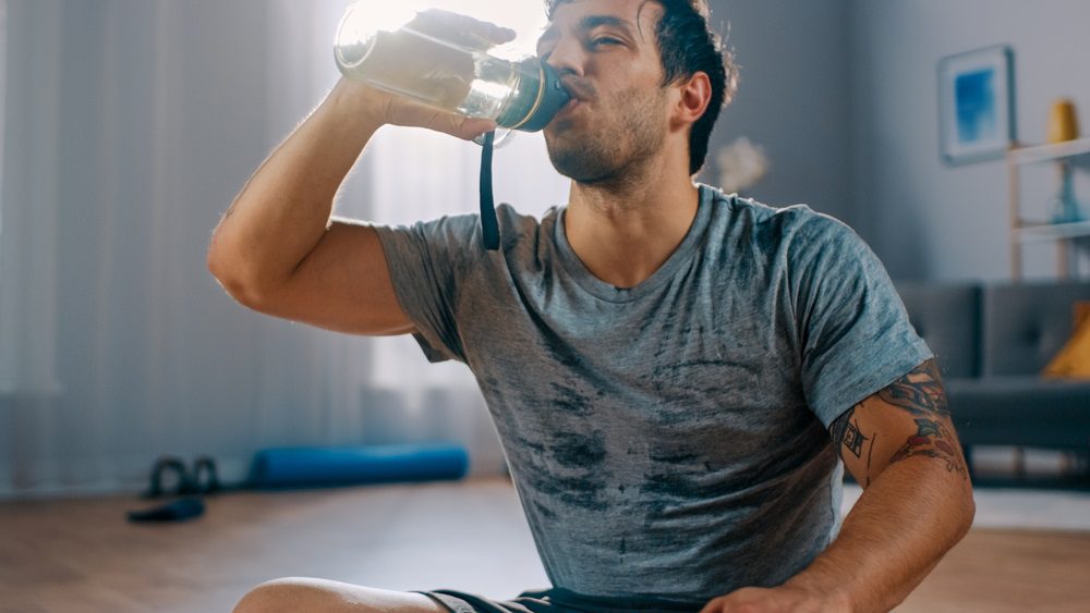 Man Drinking Alkaline Water After Workout